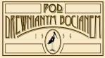 pod drewnianym bocianem logo